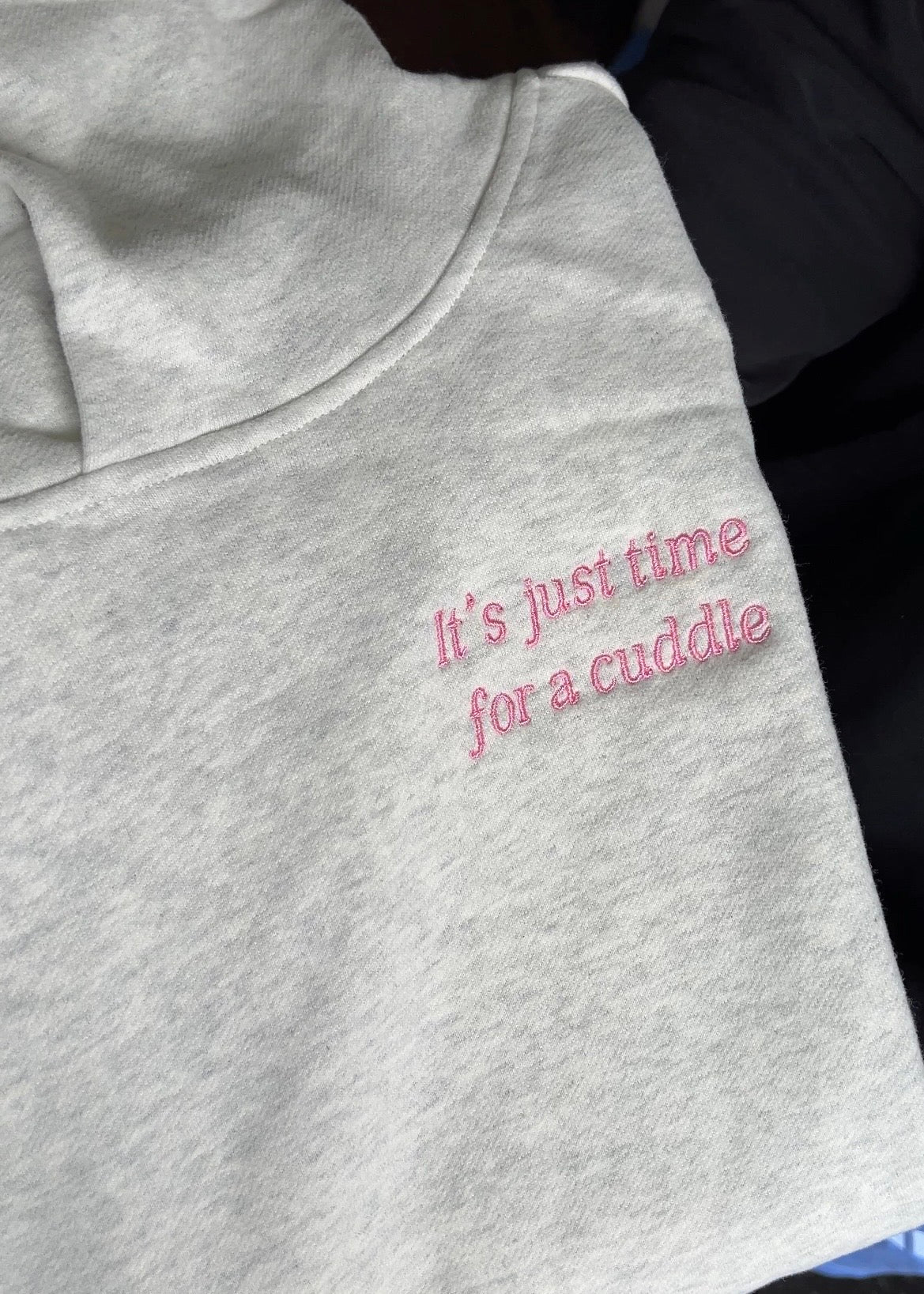 Close-up of embroidered text on hoodie, permanent thread stitching detail, Melbourne made