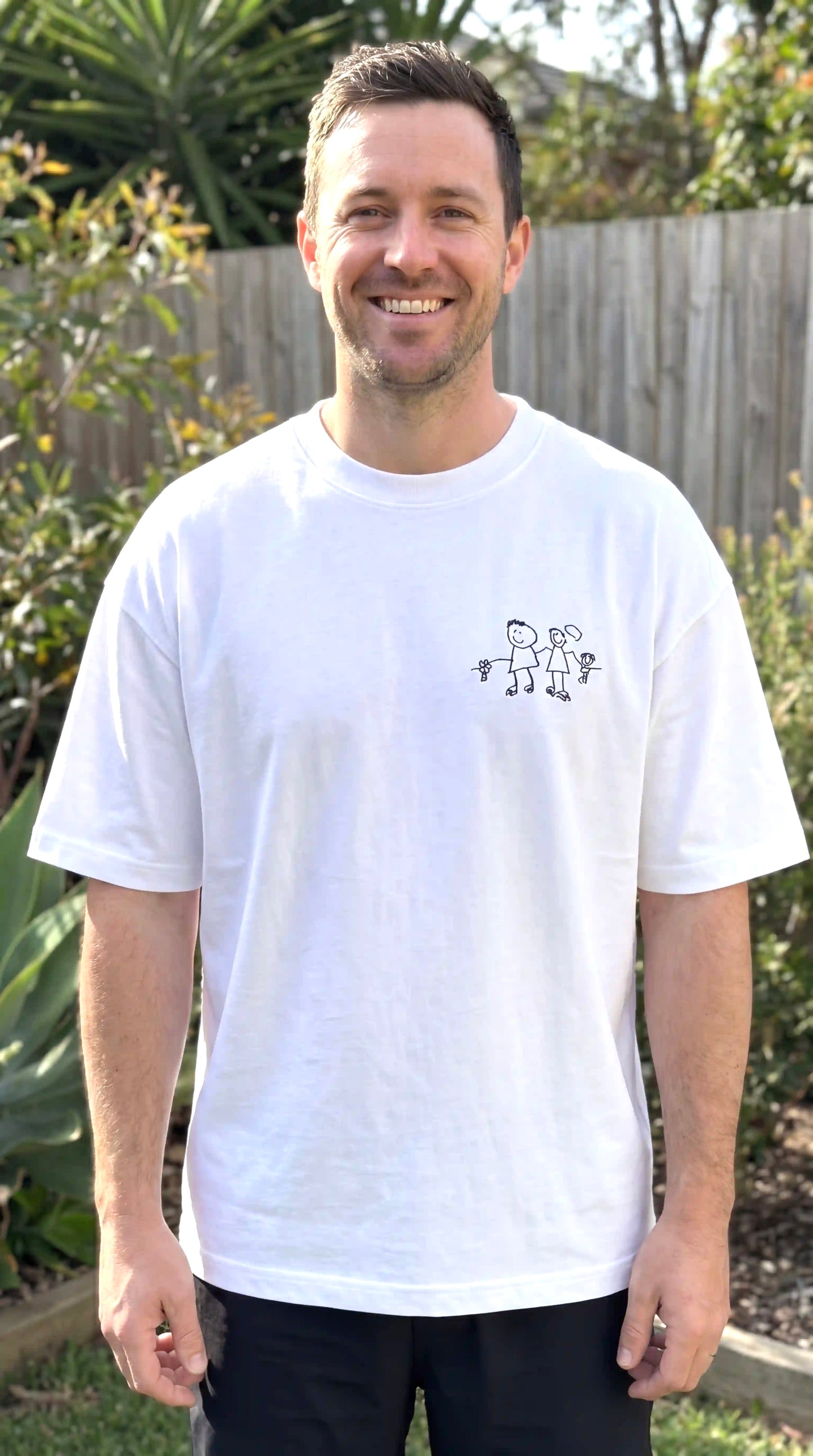 Your child's drawing embroidered on a 275GSM premium oversized tee — made in
Melbourne. Free design preview. Unlimited revisions. Ships in 3–5 days. From $99.
