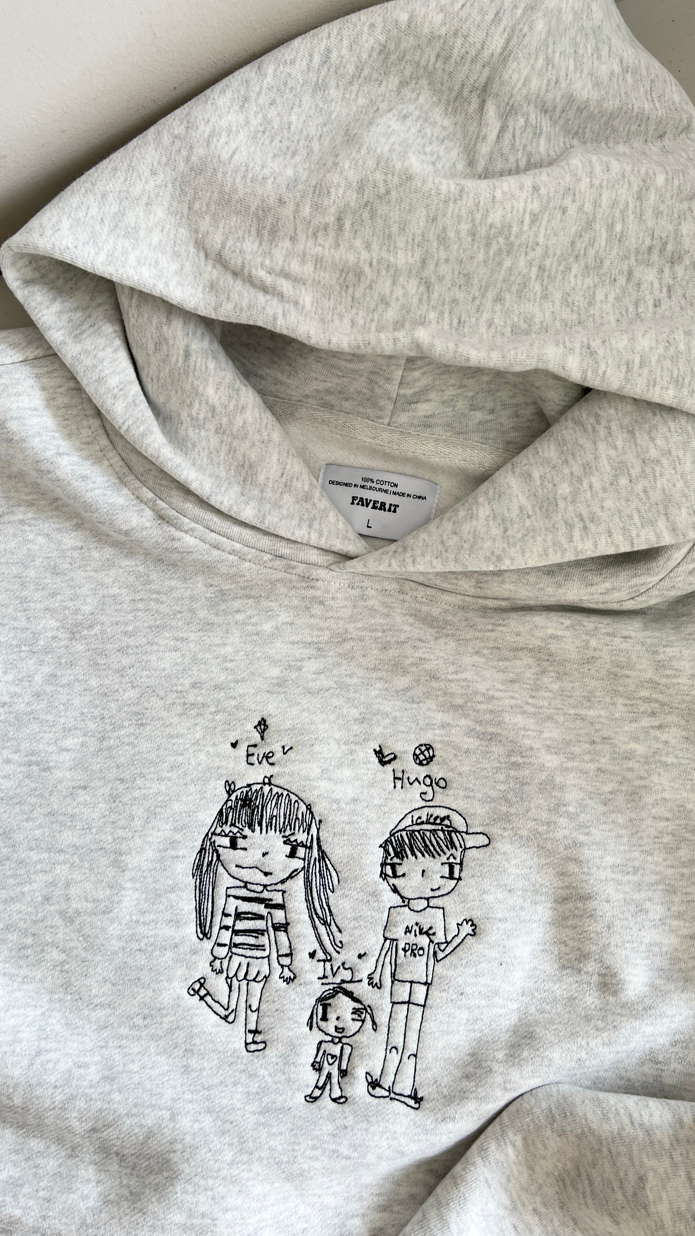 Kid's drawing embroidered on a heavyweight grey jumper for gifting