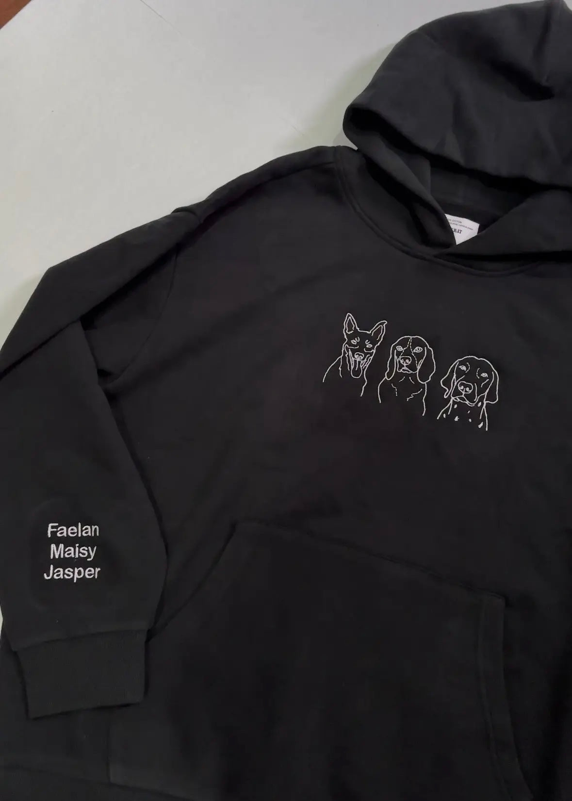 Dog face embroidered on a black heavyweight hoodie, embroidered in Melbourne 